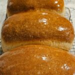 photo of 3 loaves of Honey Butter Sourdough Sandwich Bread and the recipe