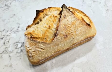 photo of a loaf of traditional sourdough bread